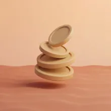 Matte clay stack of coins representing UK AI development cost planning