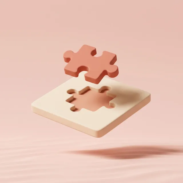 Matte clay puzzle piece slotting into its matching cutout, representing bespoke AI development