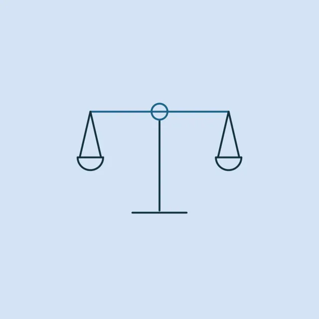 A pair of balance scales holding level