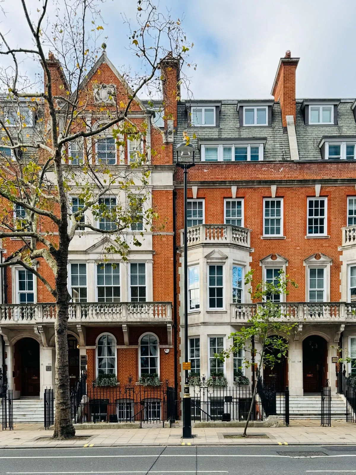 A terrace of brick houses on a London street